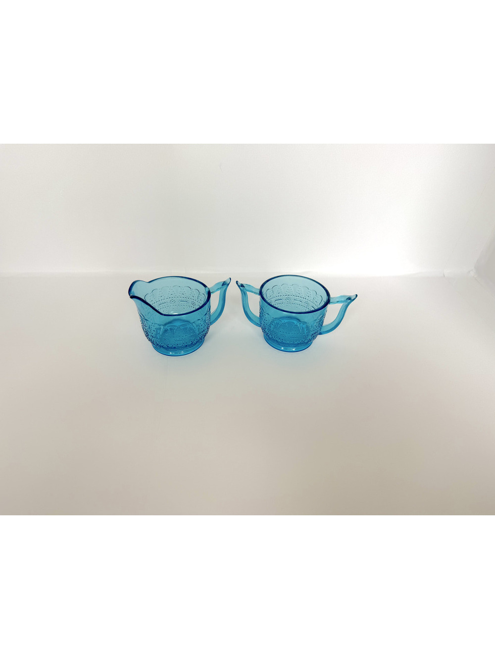 Vintage Blue Glass Creamer and Sugar Set with Embossed Design